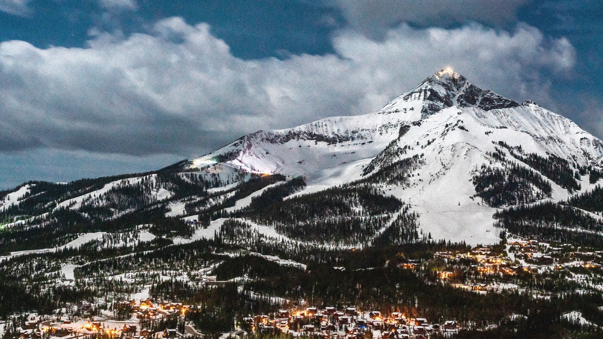 view of snow-capped peaks among the mountains in Big Sky Montana - Big Sky Montana real estate location